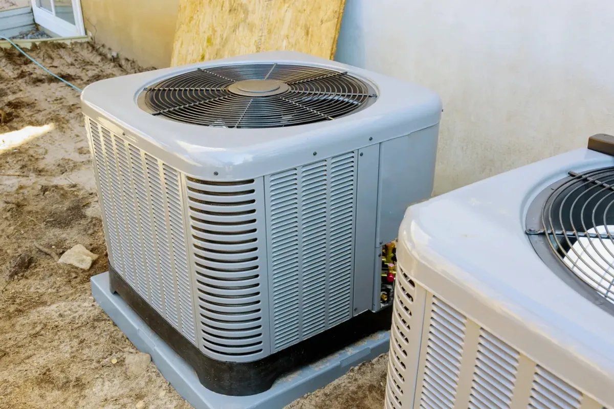 Two outdoor air conditioner condensers